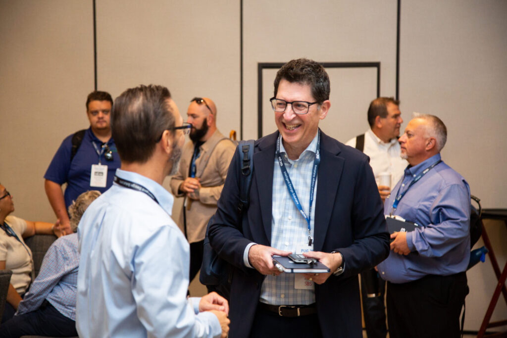 Group of professionals networking at SBS Design Conference.